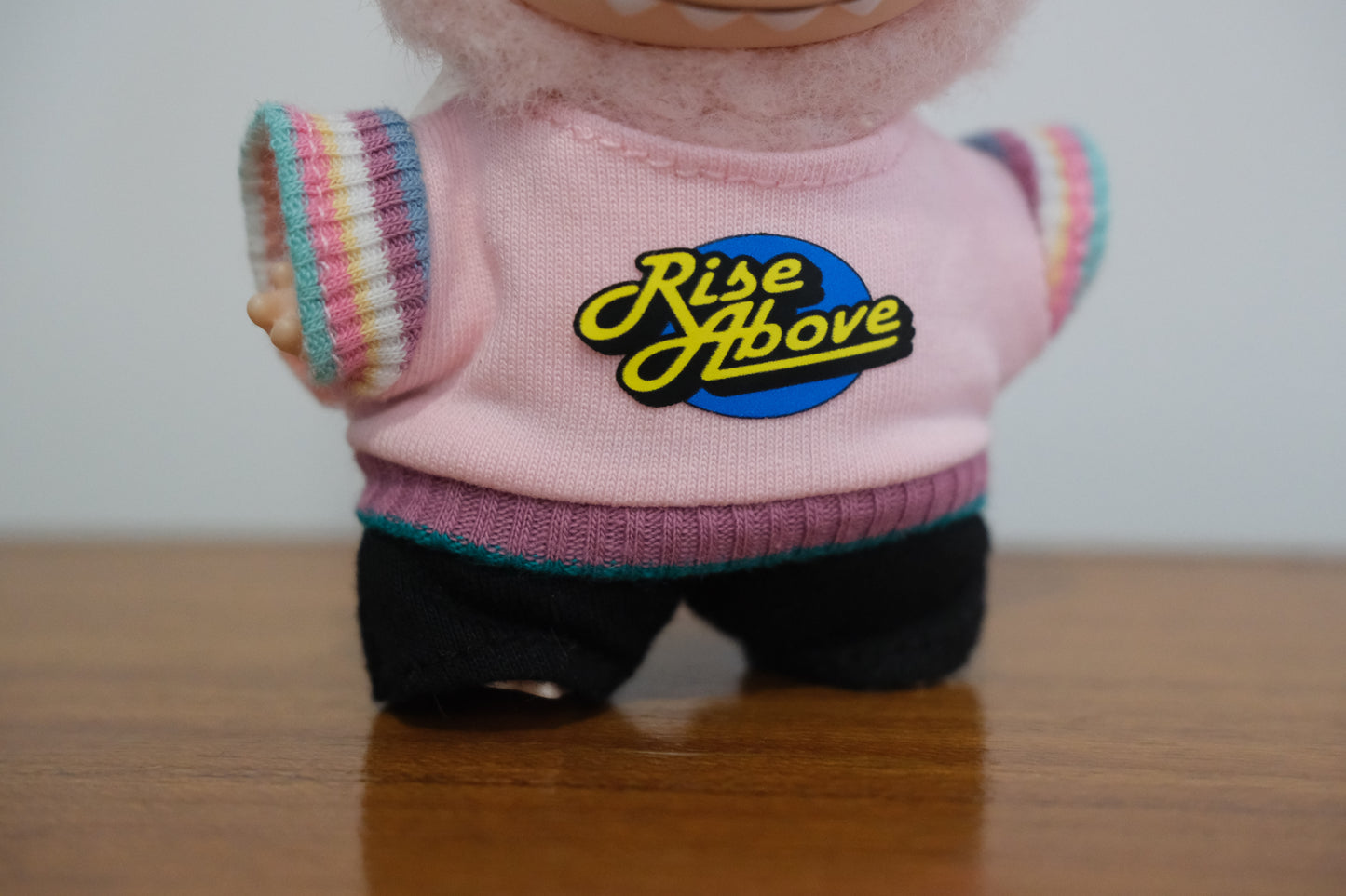 a close up of labubu-rise-above-outfit