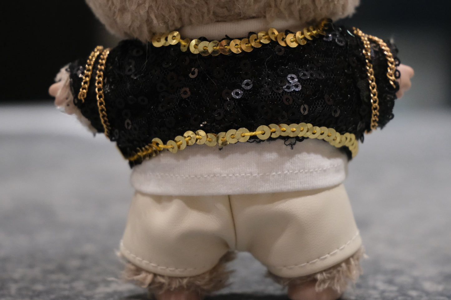 a close up of backview labubu ware kpop demon outfi