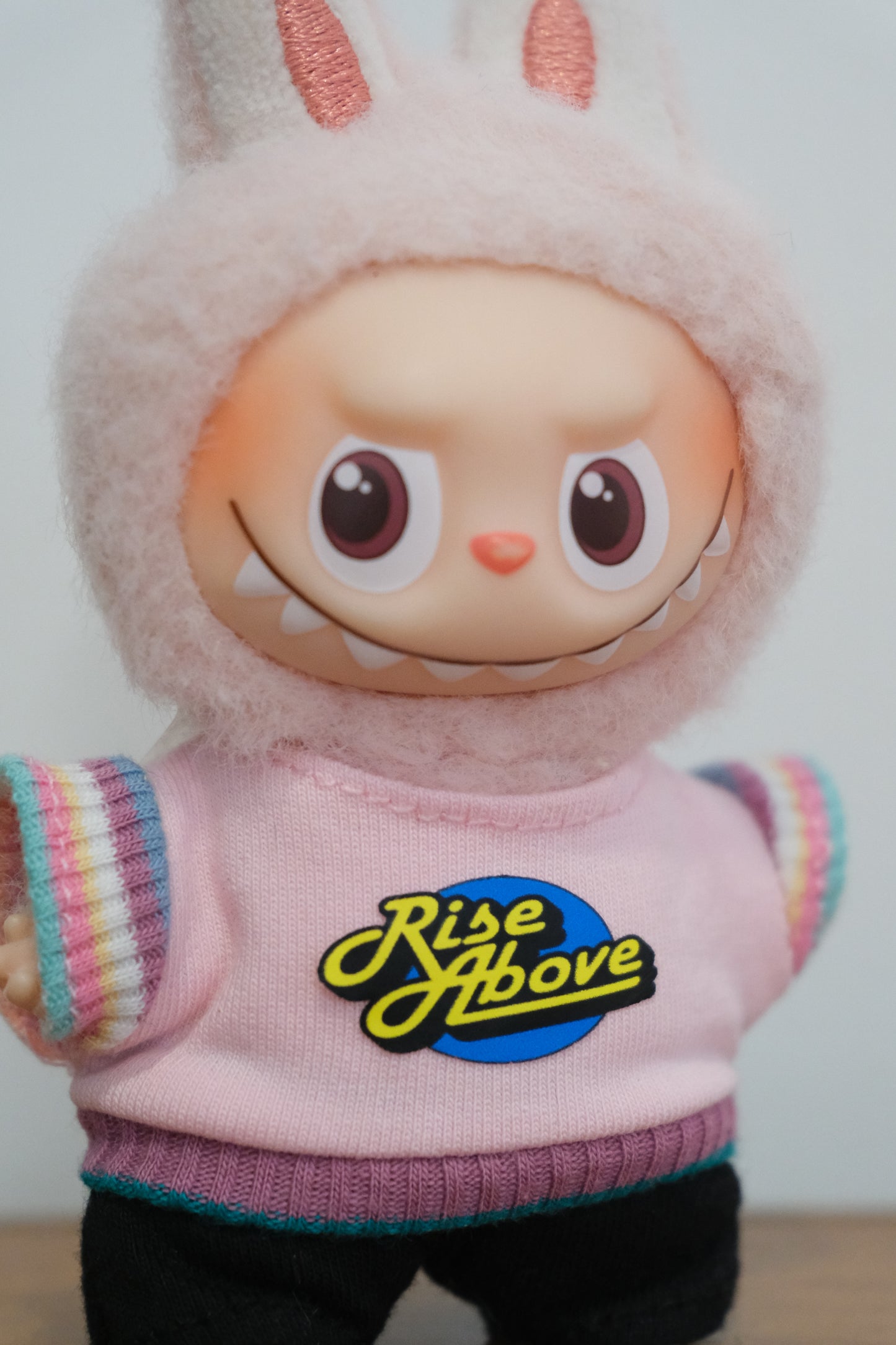 a close up of labubu-rise-above-outfit