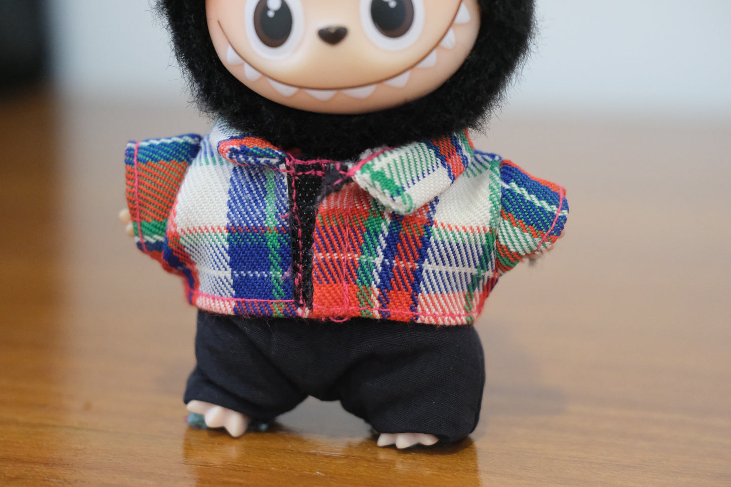 A close-up shot of the The Monsters figure's plaid flannel shirt