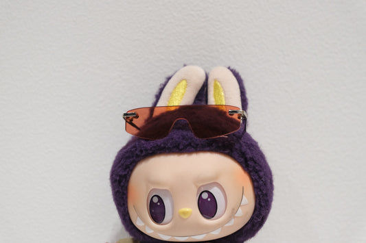 Close-up of The Monsters figure's Varsity Baseball Jacket and rimless sunglasses.