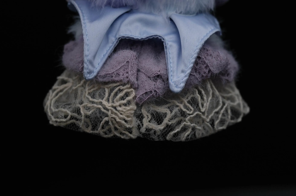 Close-up of skullpand purple dress textured fabric