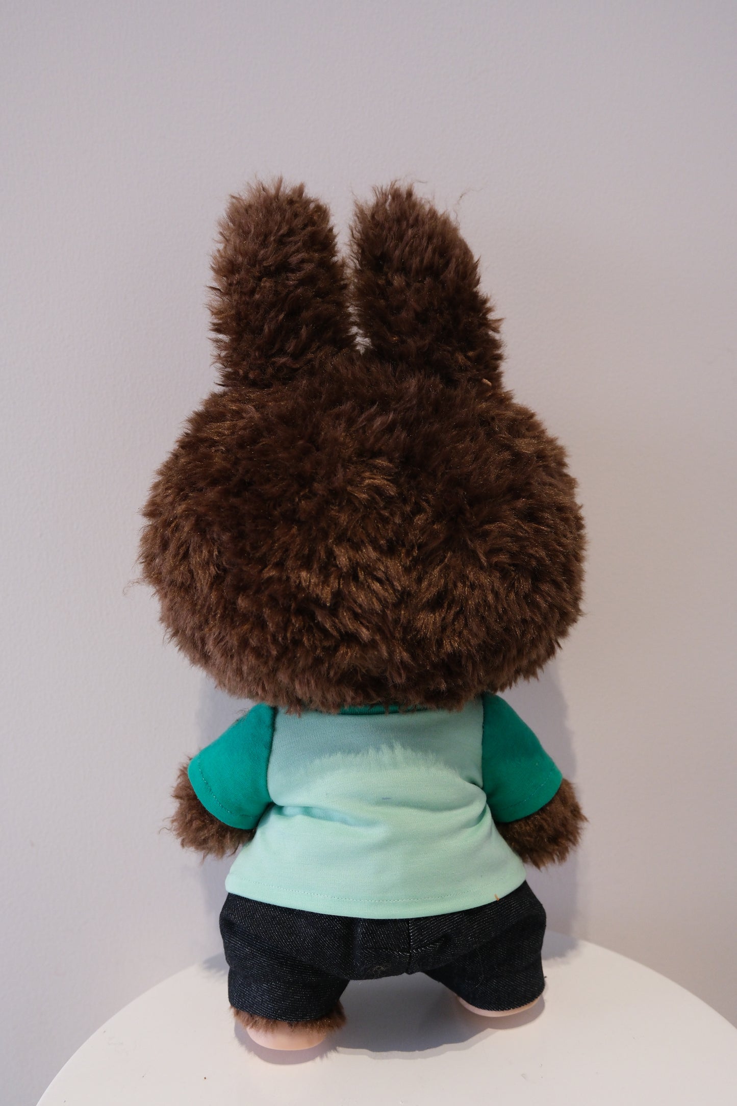 back view A cute 2-piece Labubu outfit from the Let's Checkmate series featuring soft, multi-tonal color-blocked joggers and a playful graphic T-shirt in a children's streetwear style