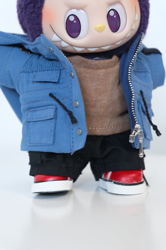 A Labubu figure dressed in a 4-piece blue winter mountaineering outfit, including a utility parka with a 'COOL' patch, black pants, and white sneakers.
