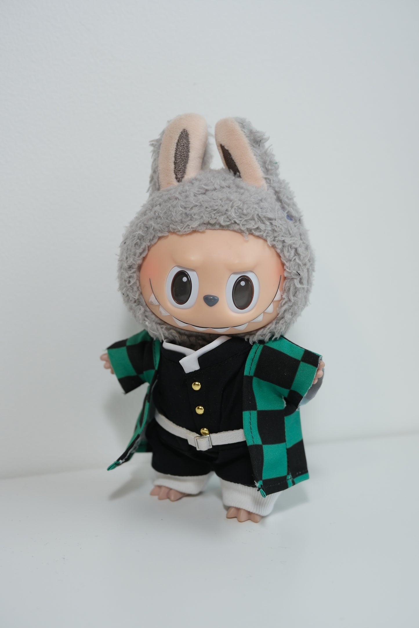 Full view of the Tanjiro outfit with black and green checkered haori and uniform.