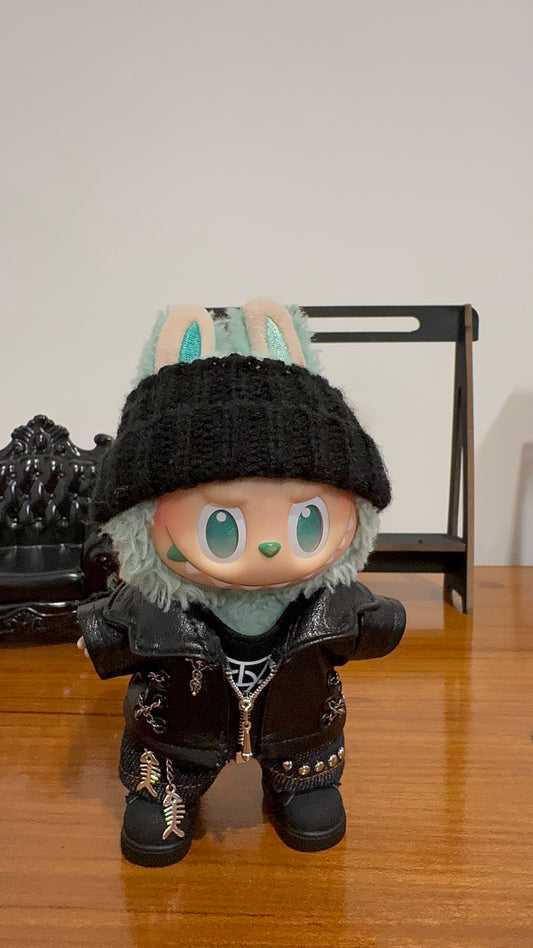 LABUBU plush doll wearing a black faux leather jacket with studs and a black beanie"
