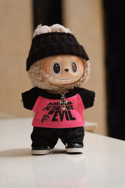 A Labubu figure wearing a 5-piece athletic streetwear outfit, including a graphic T-shirt, headband, and a silver necklace.