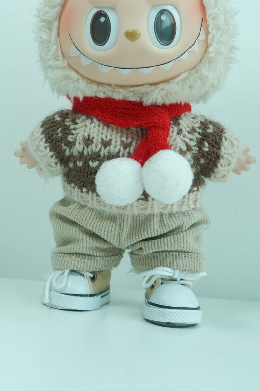 Labubu with a sweater, gloves, and a red Christmas scarf on a white background