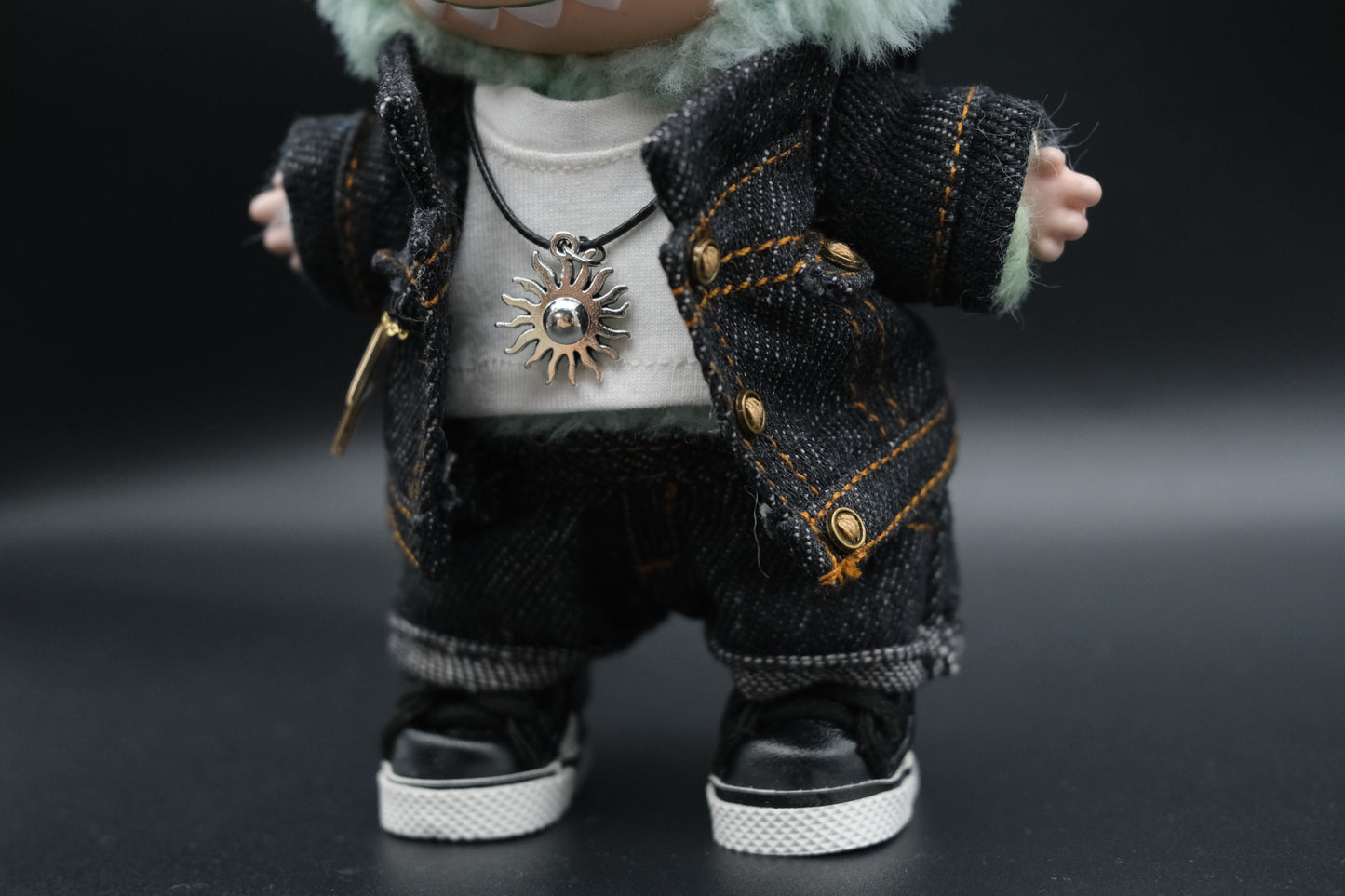 Close-up of the Labubu black denim jacket outfit