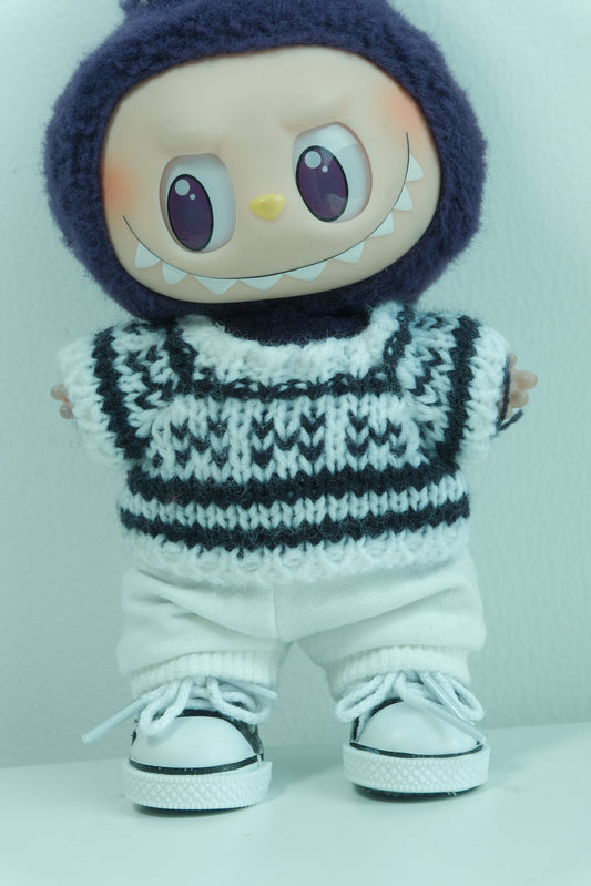 Close-up of The Monsters figure's high-contrast black and white graphic knit sweater