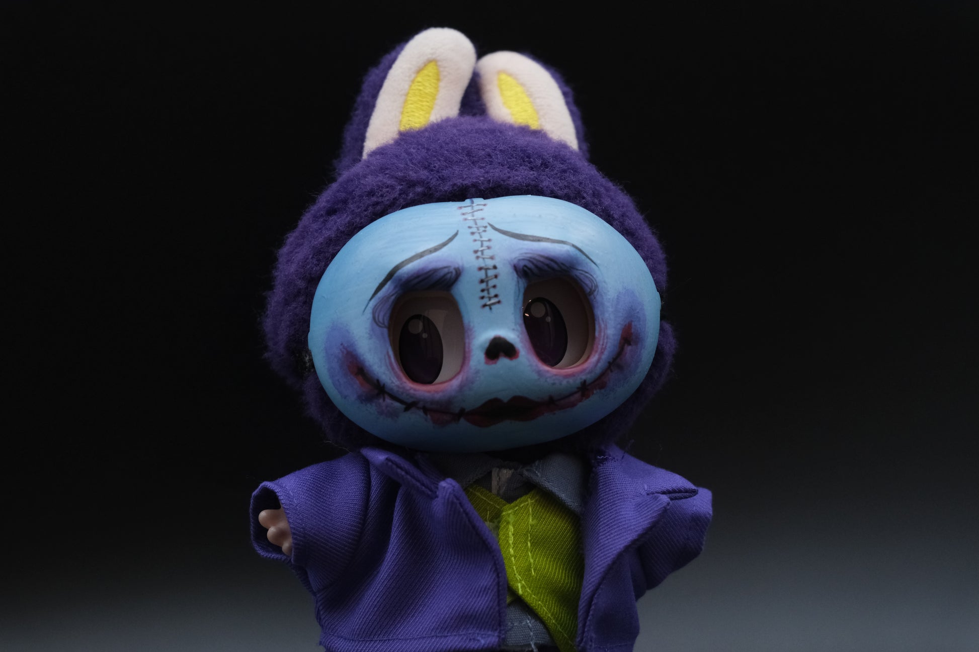 Detailed shot of the Labubu's joker outfit