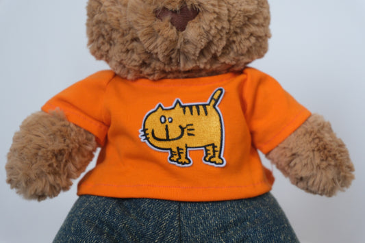 Close-up showing the flexible waistband and denim texture on the jeans for a Jellycat Bear