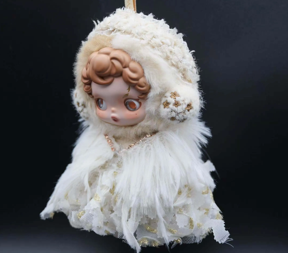 Full-body shot of a Skullpanda figure wearing a custom-made, white feather dress and a fluffy cap with lace trim.
