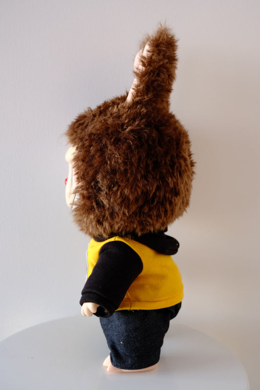 side view of 38cm Labubu figure wearing a blue Let's Checkmate series hoodie and structured denim jeans