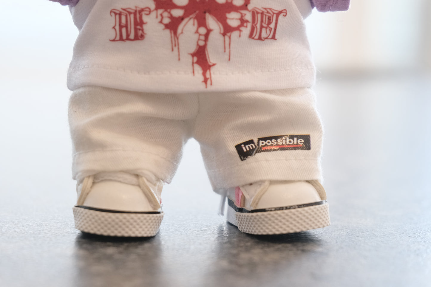 a close up of labubu sneakers, pants and punk t-shirt