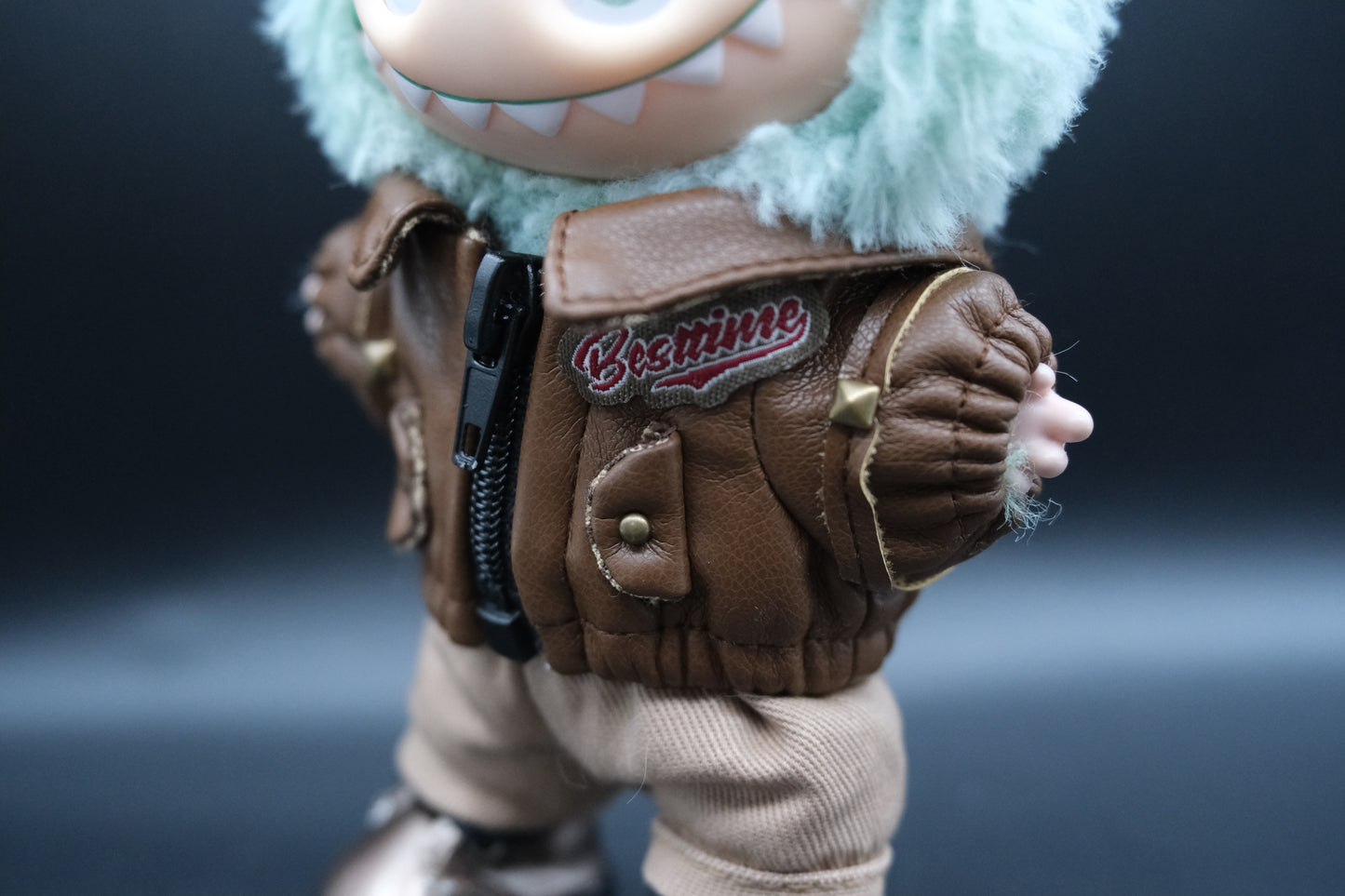 details of laubu wear a brown leather jacket, pants and shoes