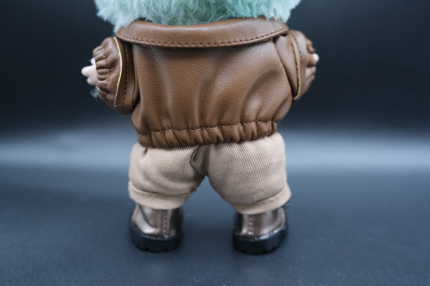 back view of laubu wear brown leather jacket, pants and shoes