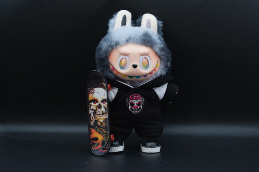 A trendy Labubu designer toy figure wearing a black and white hoodei, pants and black shoes