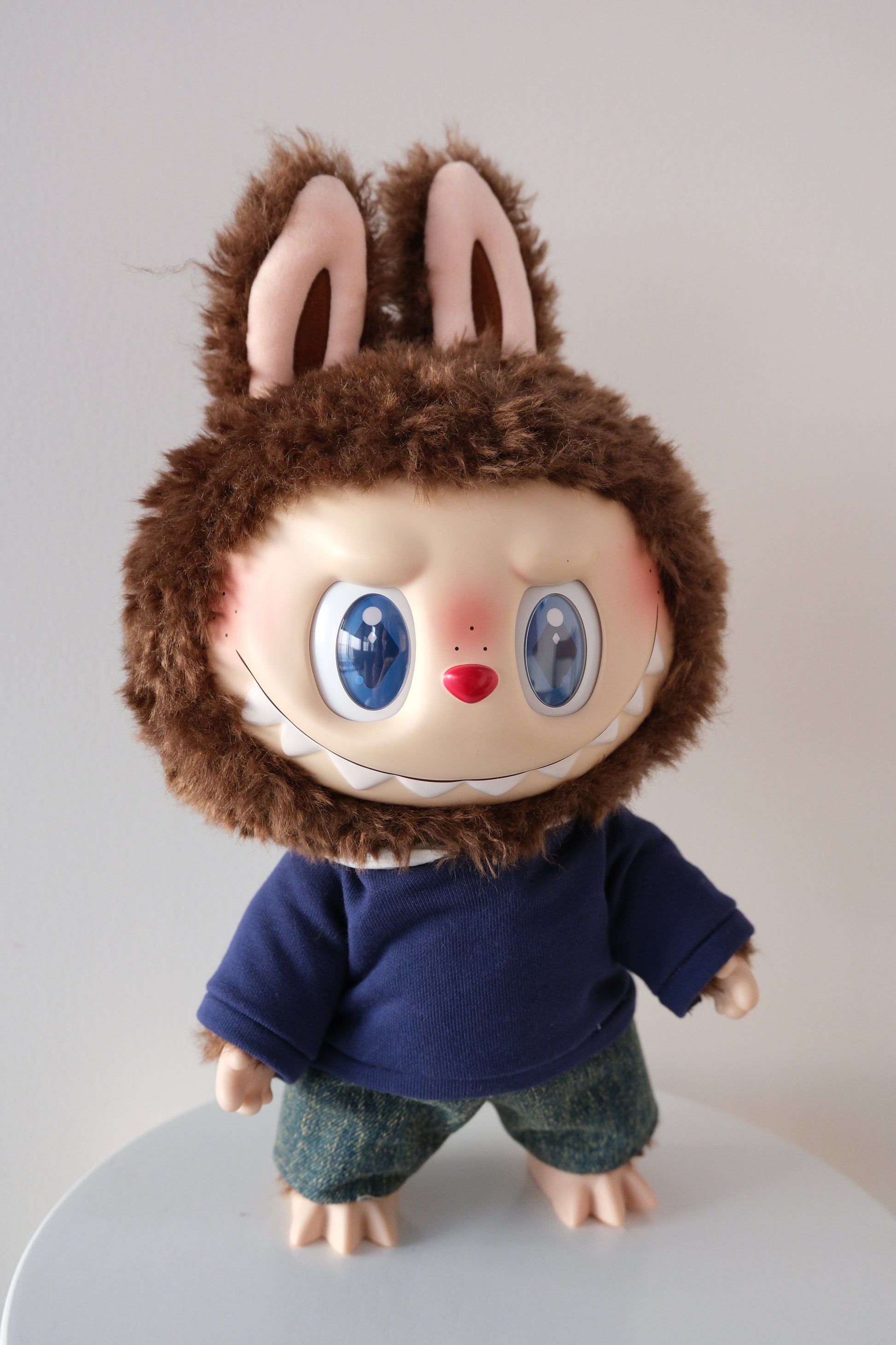 Full front view of 38cm Labubu figure wearing a Let's Checkmate series hoodie and denim jeans set.