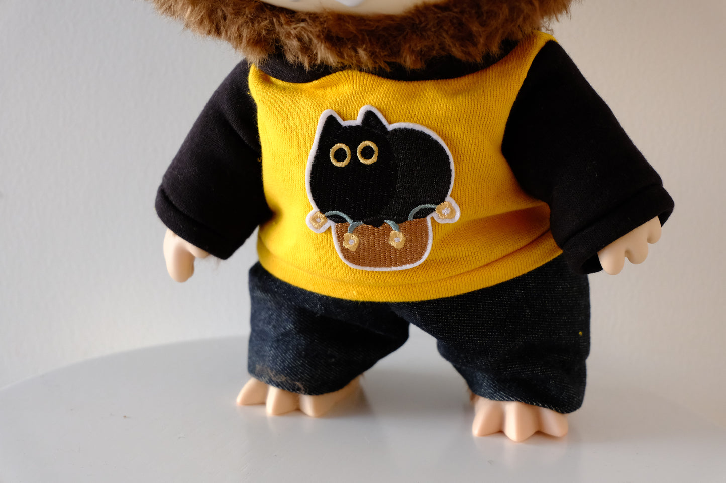 Close-up of the premium graphic print and fabric texture on the 38cm Labubu Let's Checkmate hoodie