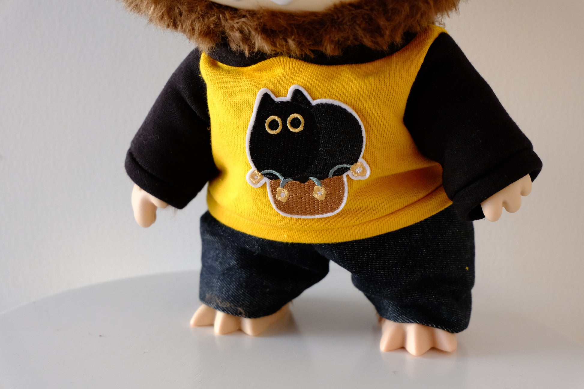 Close-up of the premium graphic print and fabric texture on the 38cm Labubu Let's Checkmate hoodie