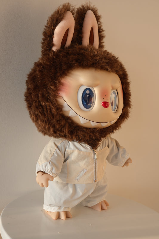 side view of 38cm Labubu in the Bejeweled set, highlighting the fit of the sequin bomber jacket