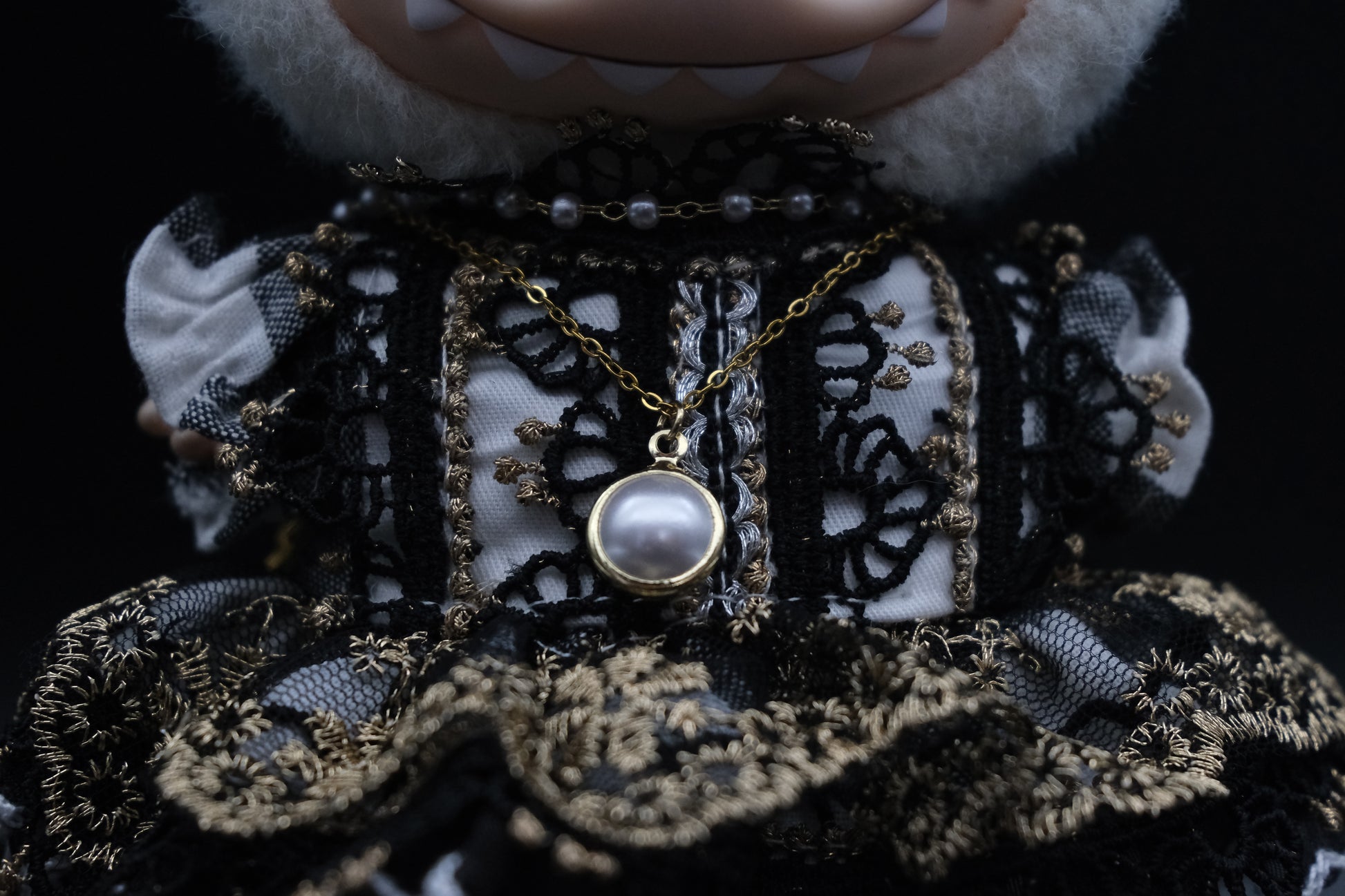 a close-up of labubu's necklace and french dress