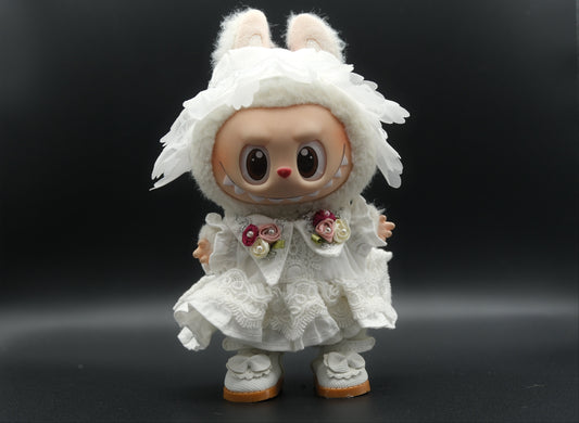 A full body shot of the Labubu figure wearing the complete white dressoutfit