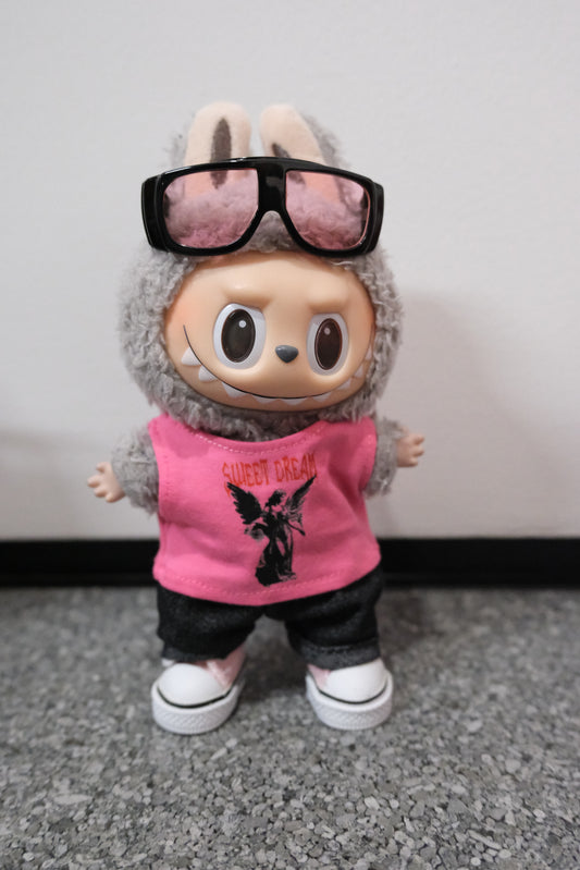 A Labubu figure wearing a 4-piece modern casual outfit, including a pink vest, denim jeans, dark sunglasses with a metallic frame, and white sneakers
