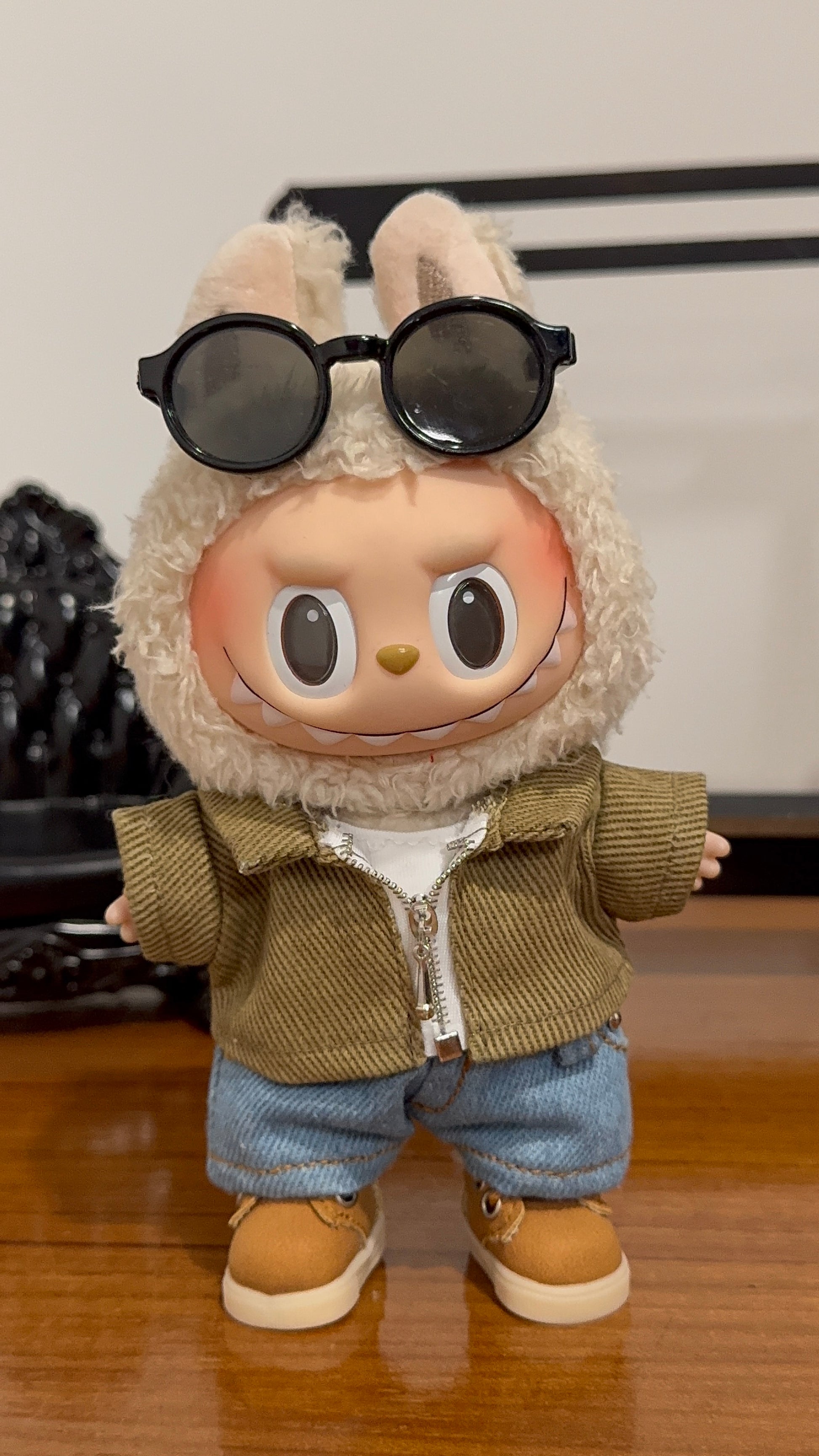A collectible figure wearing a 5-piece denim street style outfit, including a jacket, T-shirt, jeans, shoes, and sunglasses.