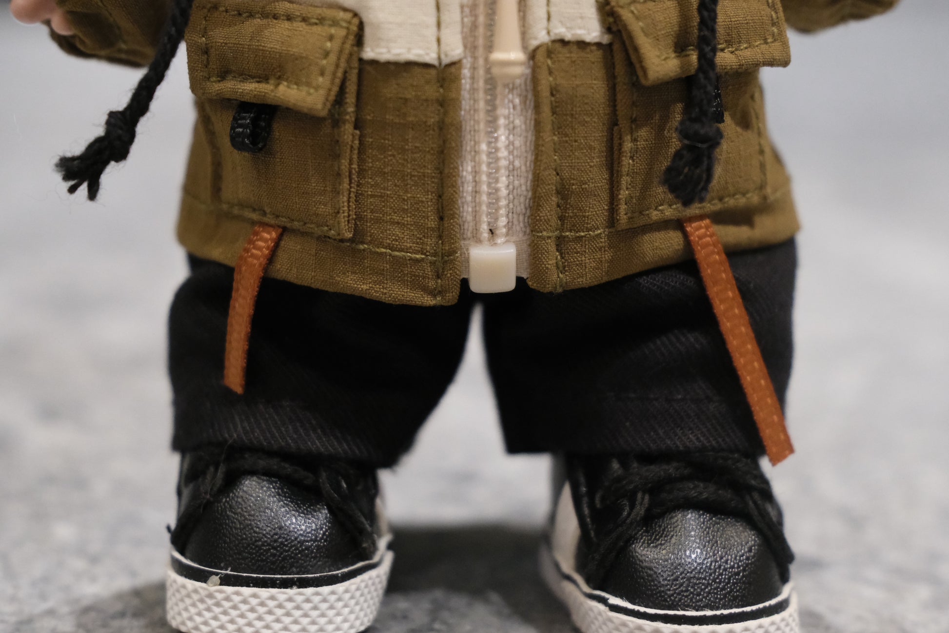 Detailed shot of the Labubu figure's red parka, zipper, and drawstrings.



