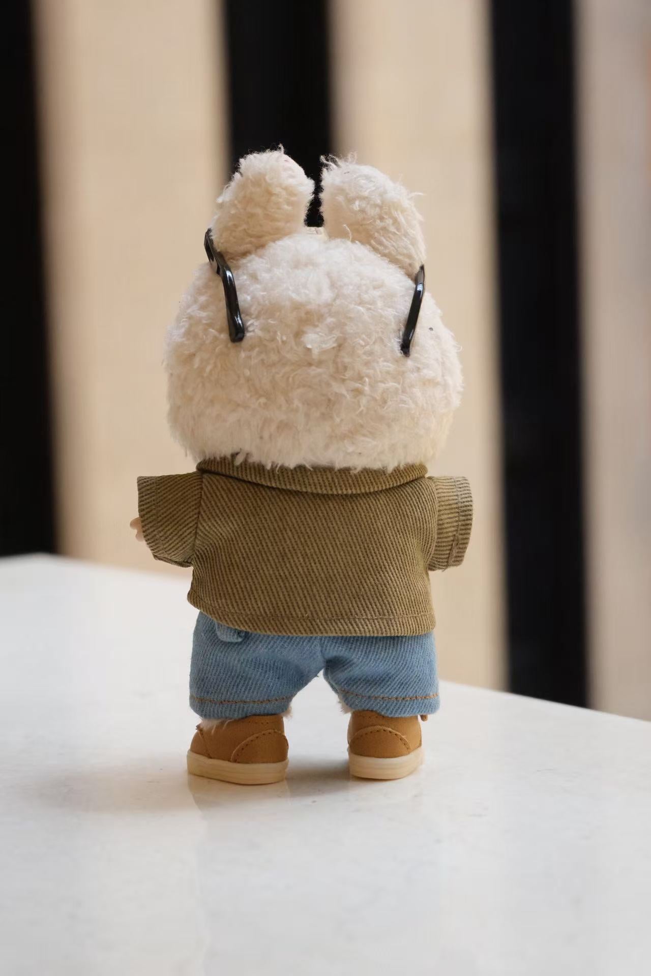 A collectible figure wearing a 5-piece denim street style outfit, including a jacket, T-shirt, jeans, shoes, and sunglasses.