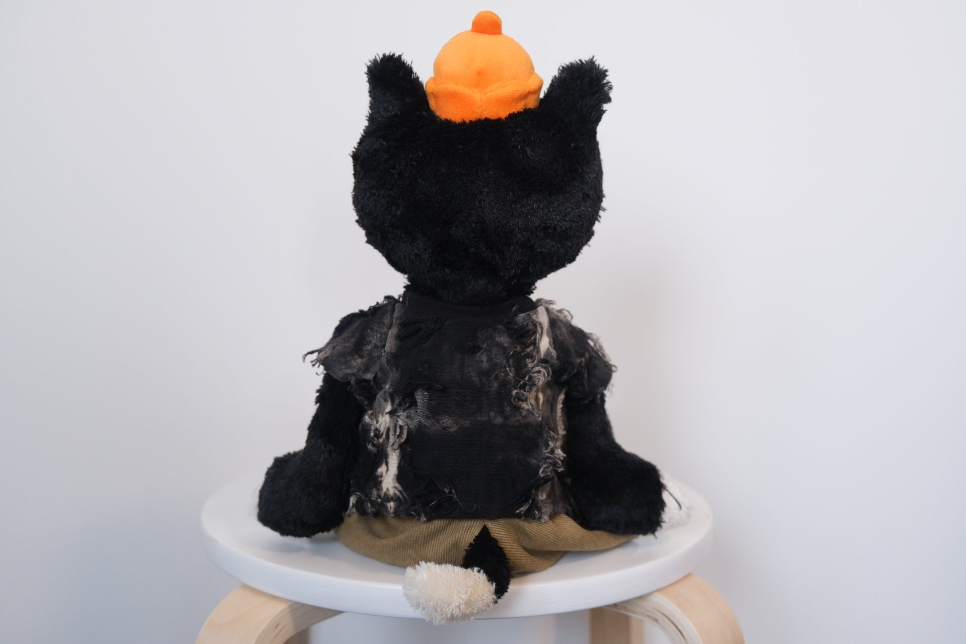 back view of designer-tee-pants-set.jpg	Jellycat Jack wearing a 2-piece elevated casual outfit with a designer T-shirt and tailored pants