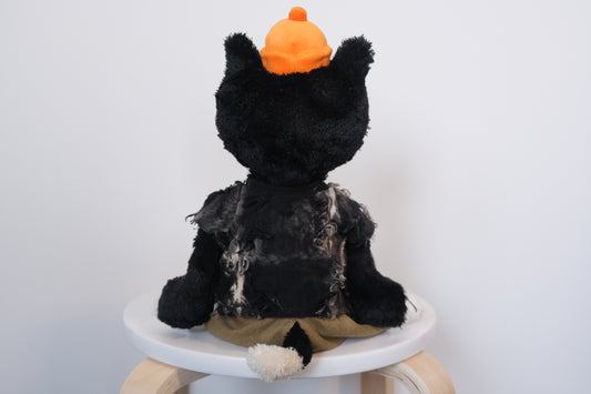 back view of designer-tee-pants-set.jpg	Jellycat Jack wearing a 2-piece elevated casual outfit with a designer T-shirt and tailored pants