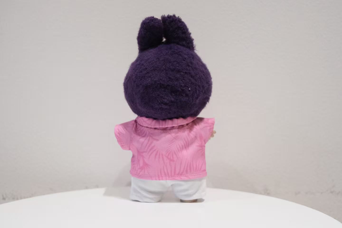 back view of the Labubu figure in the Nick Wilde inspired shirt, tie, and trousers outfit.