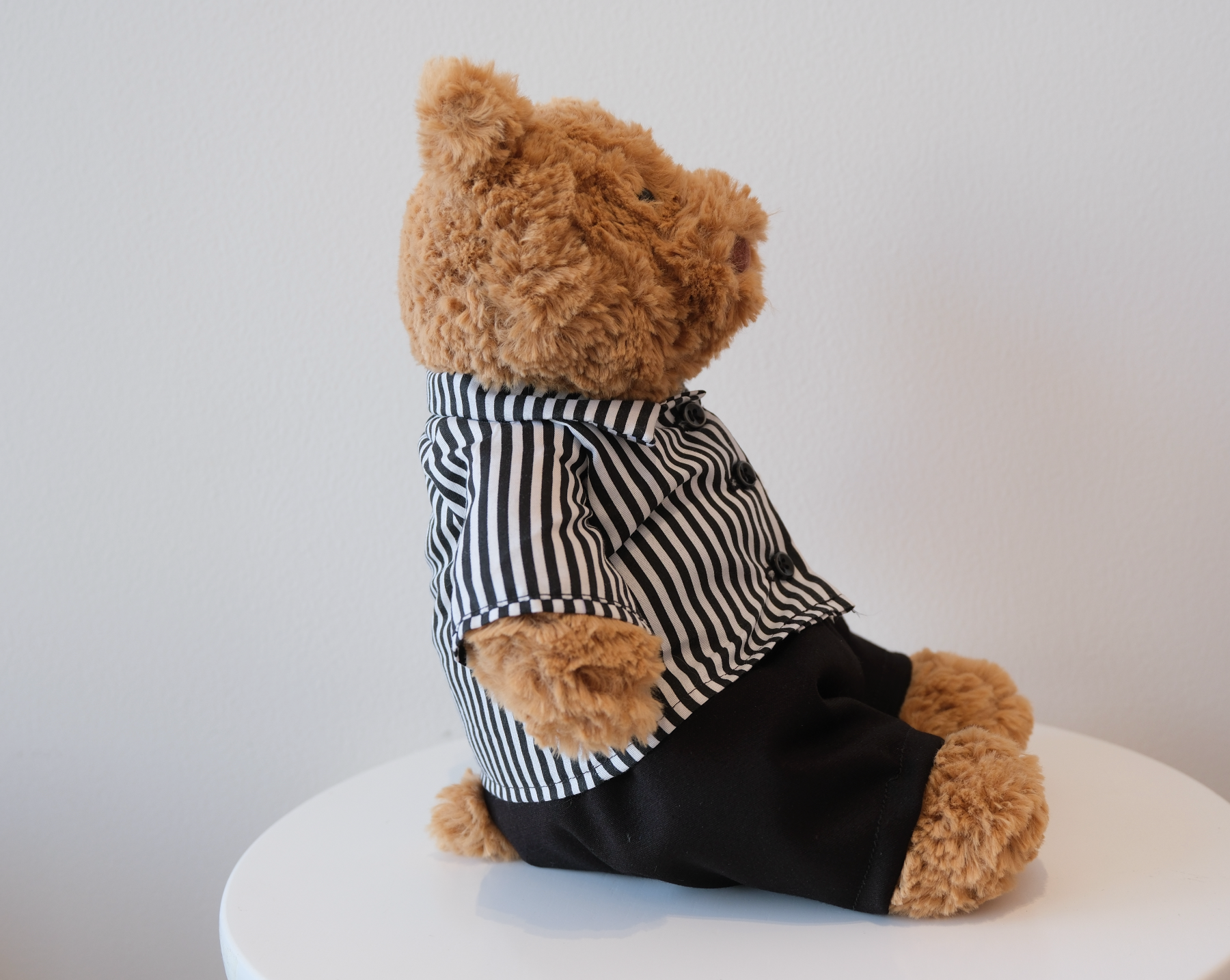 Close-up of the miniature collared shirt detail on a Jellycat Bartholomew Bear doll.