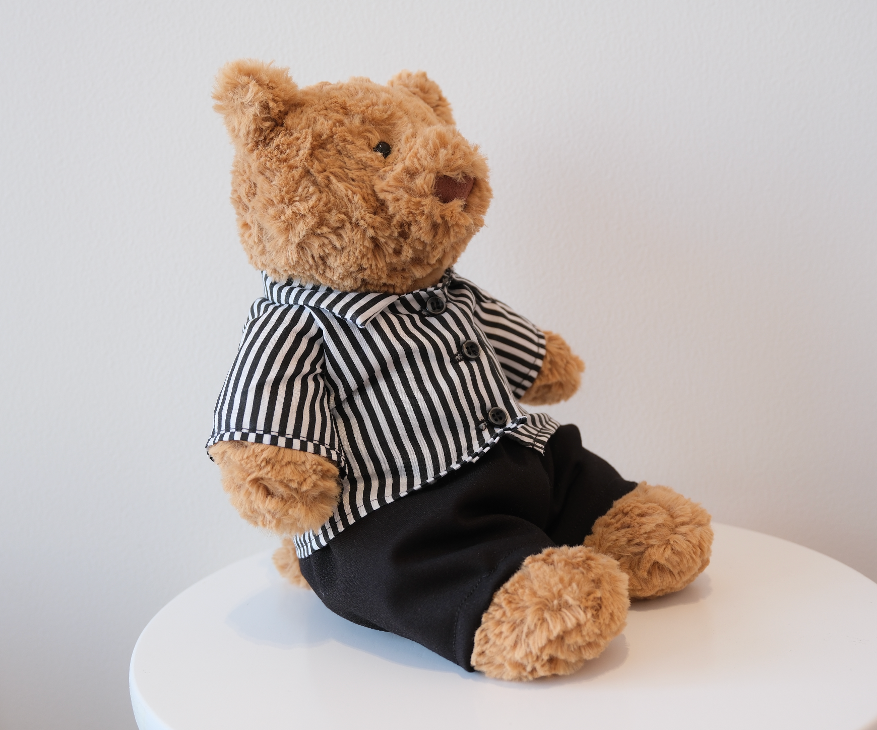 Close-up of the miniature collared shirt detail on a Jellycat Bartholomew Bear doll.