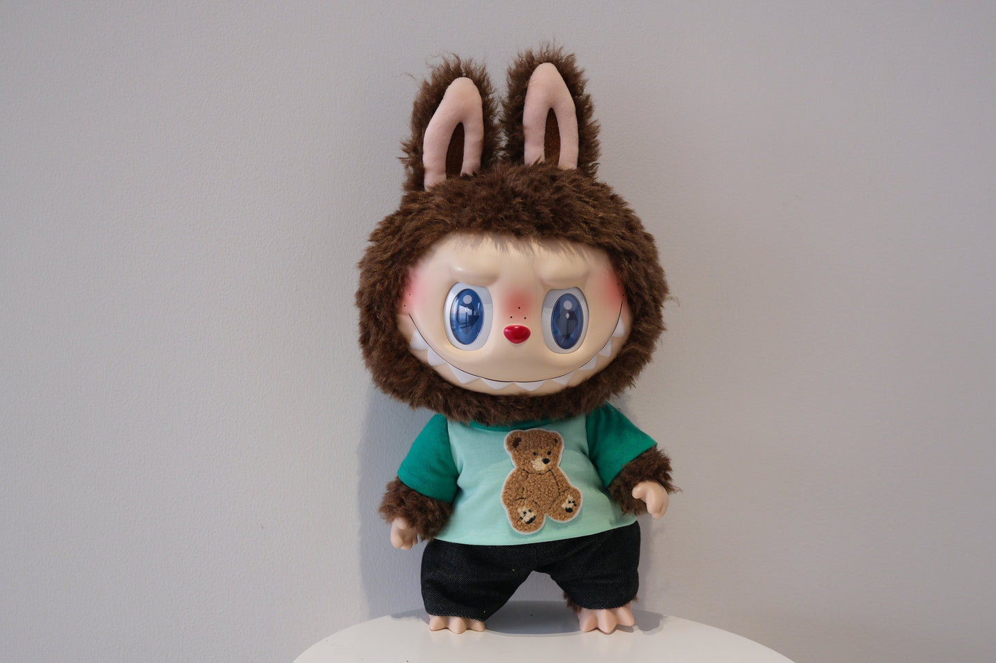 A cute 2-piece Labubu outfit from the Let's Checkmate series featuring soft, multi-tonal color-blocked joggers and a playful graphic T-shirt in a children's streetwear style