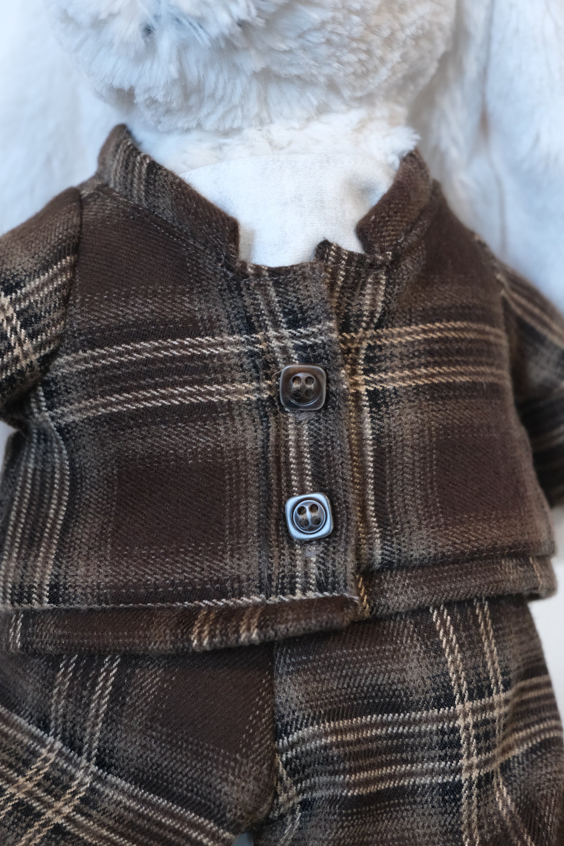 Close-up of the quilted texture on a 2-piece jacket set for a Jellycat Bunny