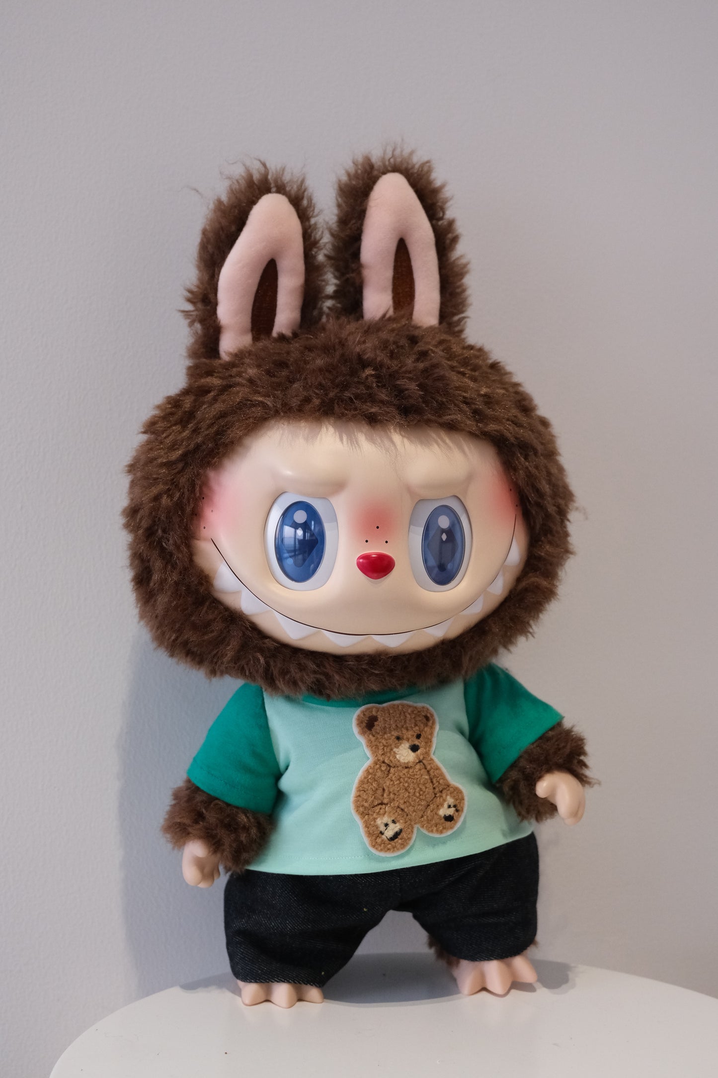 A cute 2-piece Labubu outfit from the Let's Checkmate series featuring soft, multi-tonal color-blocked joggers and a playful graphic T-shirt in a children's streetwear style