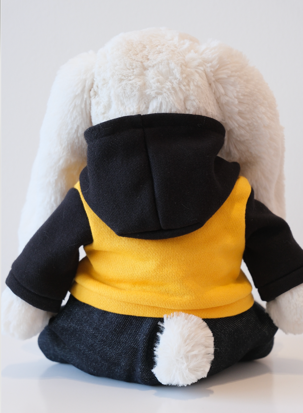 Close-up of the miniature soft fabric hoodie and hood detail on a Jellycat Bunny doll.