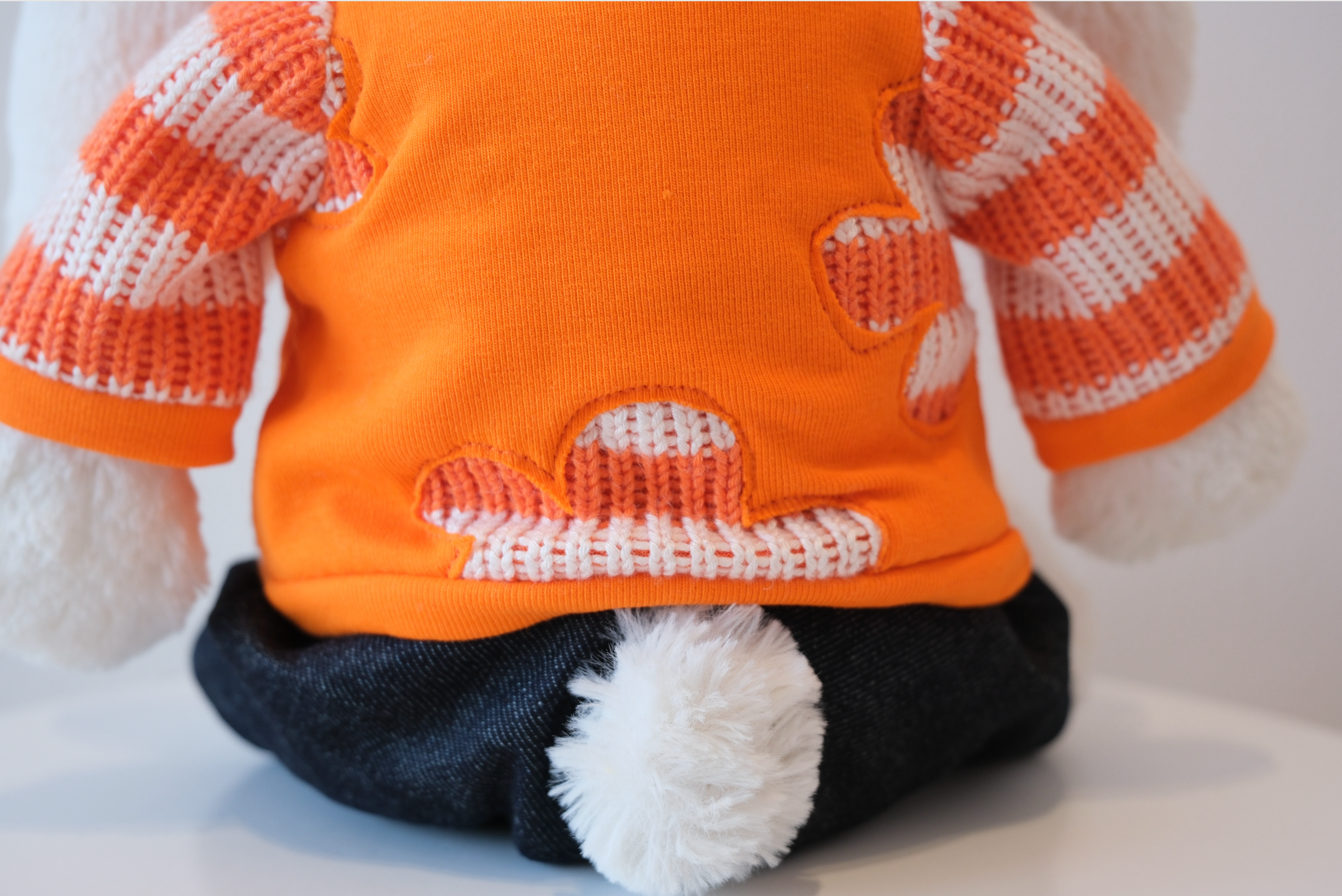 Close-up of the miniature soft fabric crewneck sweatshirt detail on a Jellycat Bunny doll.