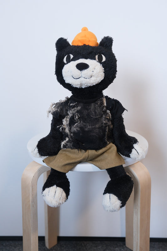 Jellycat Jack wearing a 2-piece elevated casual outfit with a designer T-shirt and tailored pants