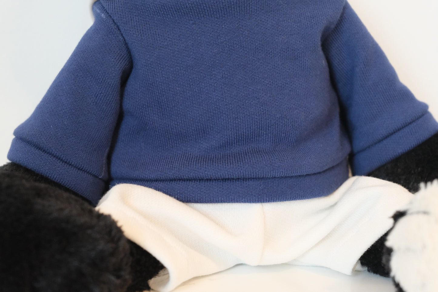 Close-up of the miniature urban blue hoodie fabric and quality stitching designed for Jellycat Jack