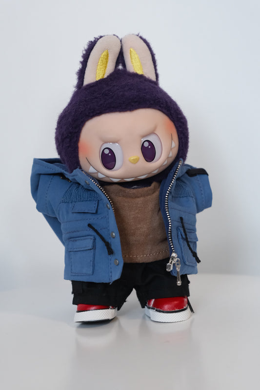 A Labubu figure dressed in a 4-piece blue winter mountaineering outfit, including a utility parka with a 'COOL' patch, black pants, and white sneakers.