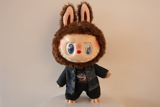 Labubu THE MONSTERS Let's Checkmate Series figure wearing a 3-piece urban streetwear outfit featuring a multi-tonal patchwork denim jacket, black t-shirt, and matching denim pants