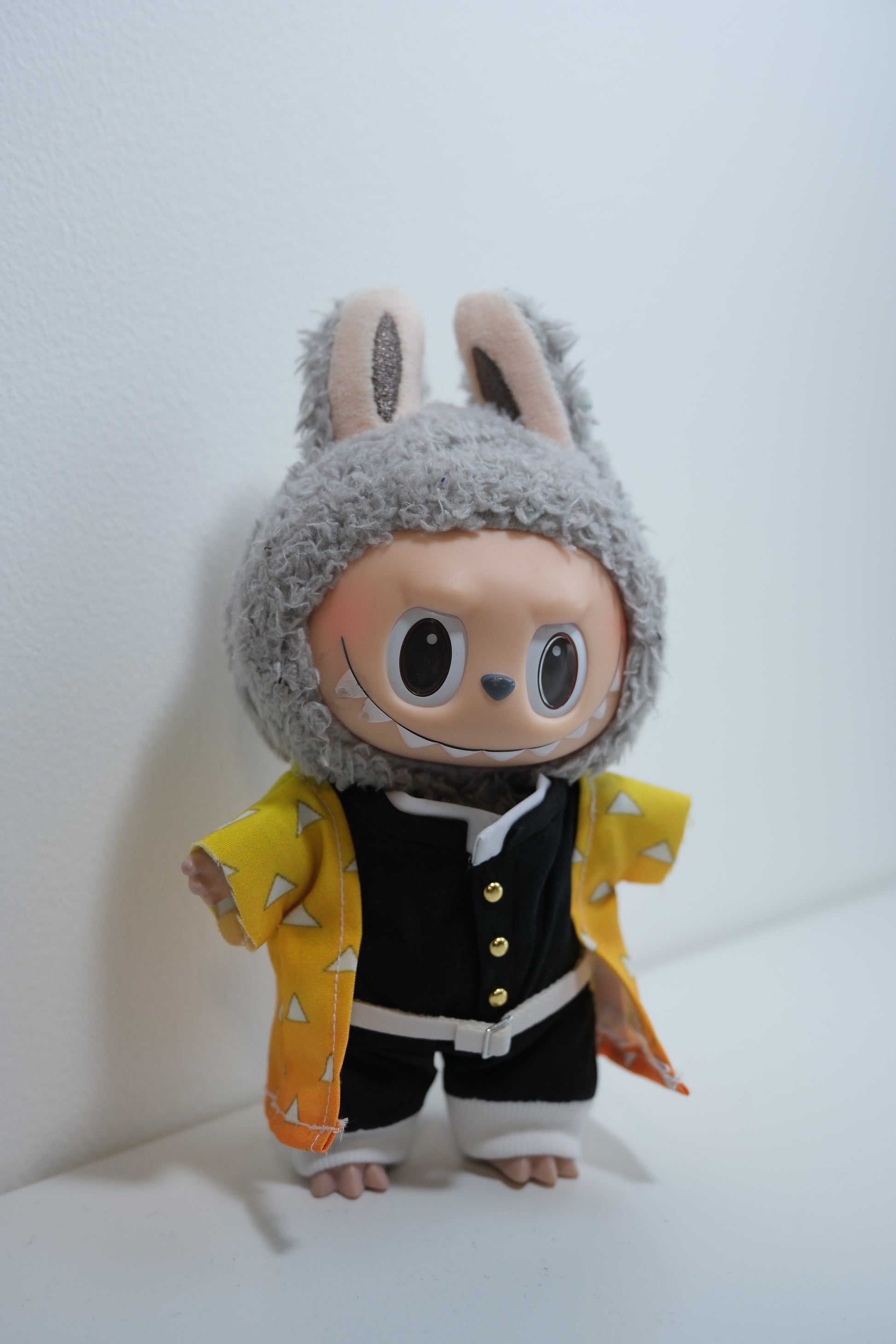 Labubu figures wearing Demon Slayer inspired cosplay outfits : Zenitsu.