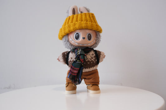 Labubu figure wearing a 5-piece winter knit outfit, including a Fair Isle sweater and yellow beanie