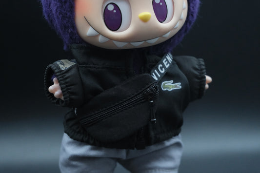 close up of labubu's wear black coat, cross body bag and gray pants