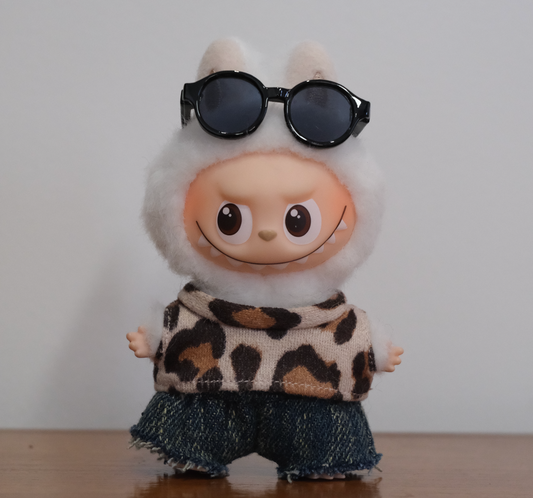 Labubu pin for love figure wearing a 3-piece fuzzy leopard print outfit with distressed denim shorts.